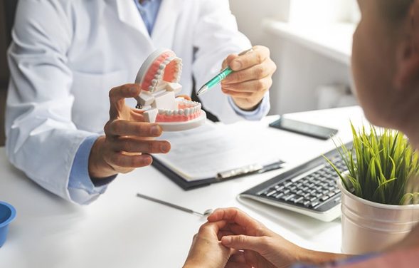 a dentist explaining how dental implants work