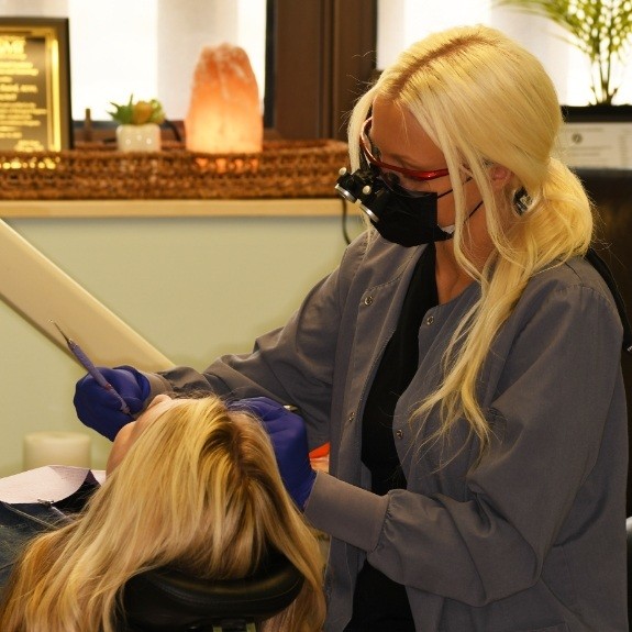 Dental team member treating dentistry patient