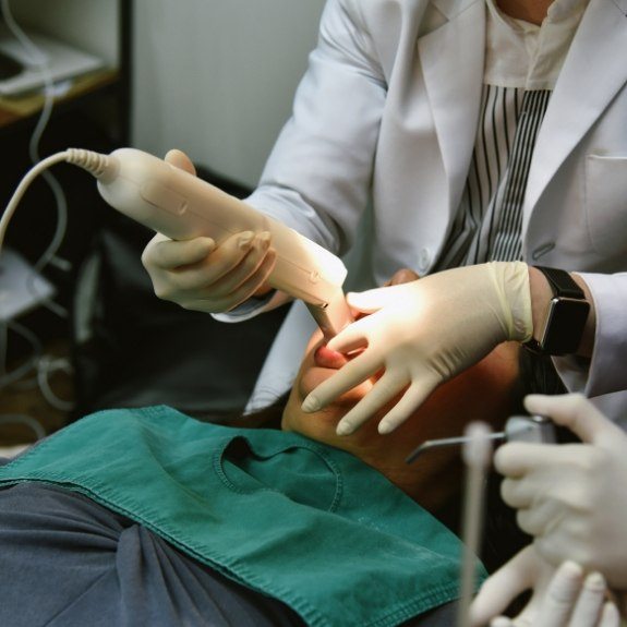 Dentist capturing digital bite impressions