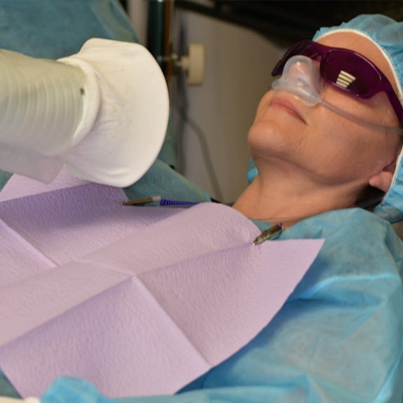 Dentist performing safe mercury amalgam removal technique treatment