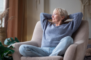 Woman leaning back and resting in her armchair