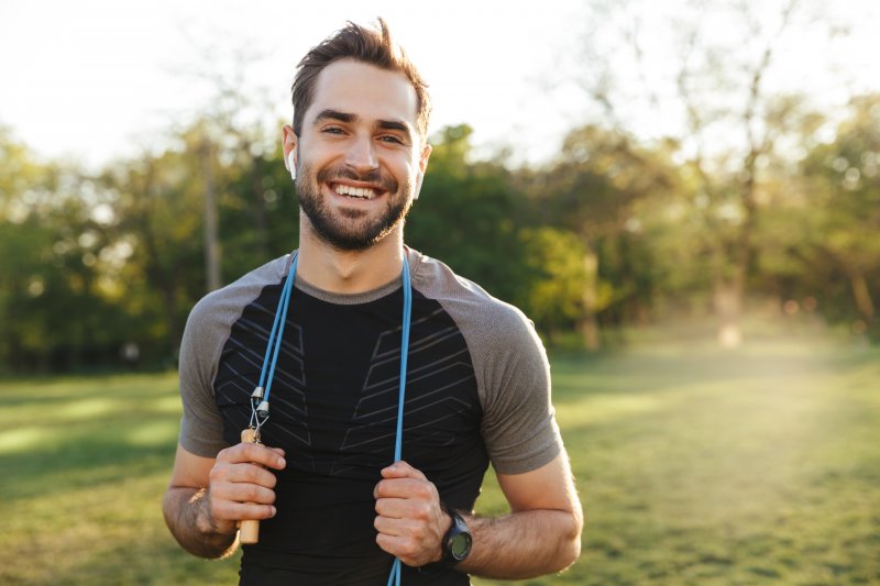 Patient with good gum health smiling after exercise